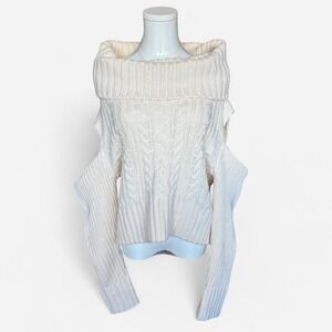 Cream cable knit off the shoulder sweater with a relaxed fit